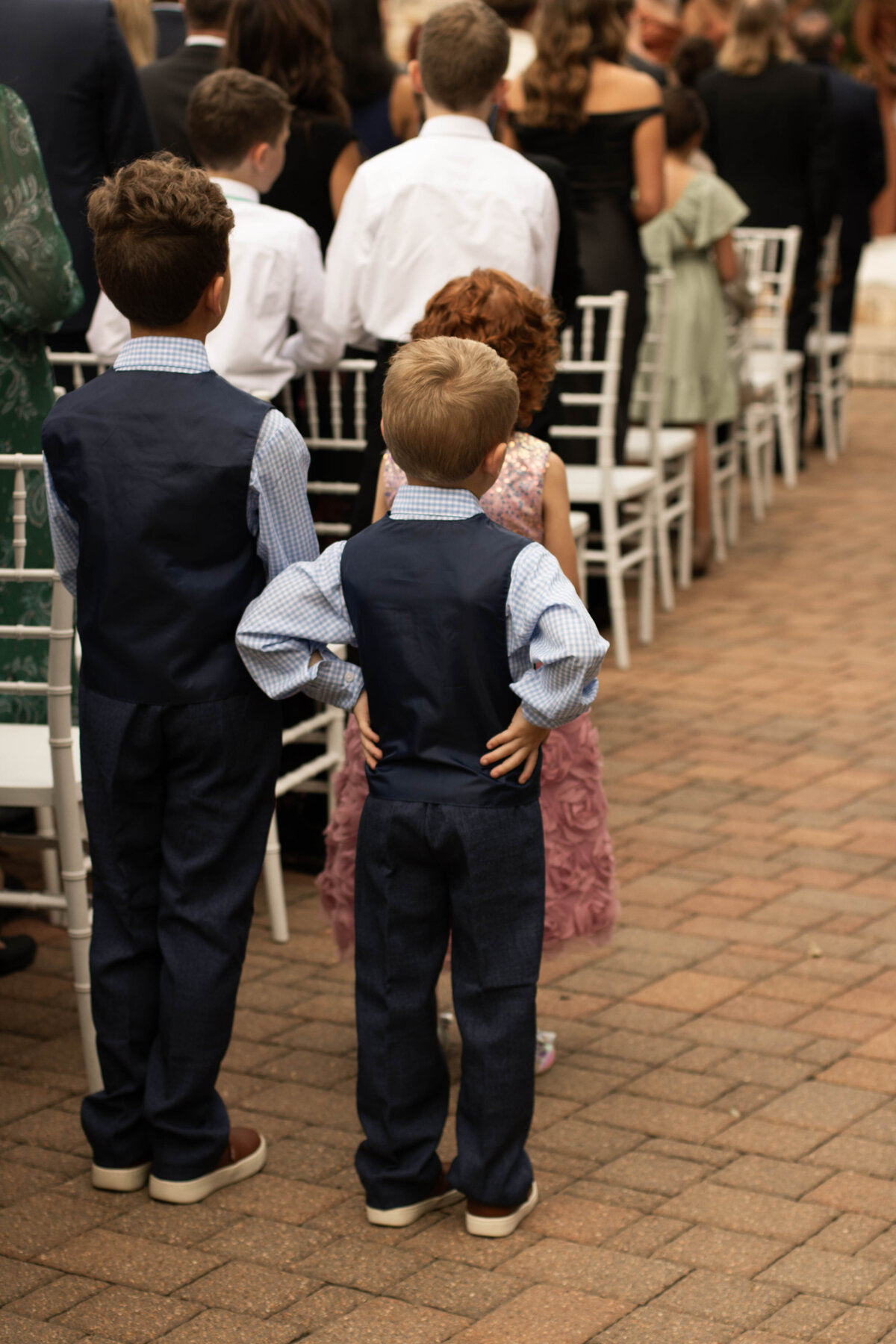 little wedding guest patiently waiting to sit down 