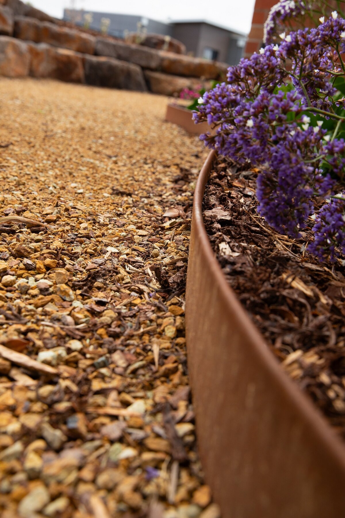 Sleek landscape design with garden bed edging by total landscape & design Warrnambool