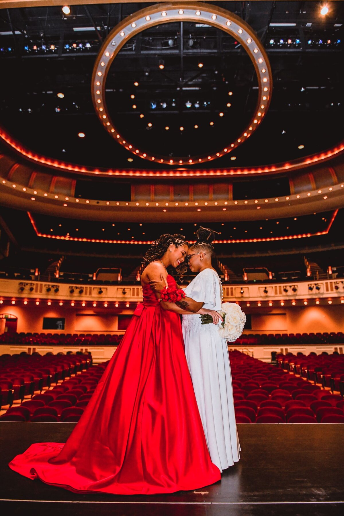 23 - Mahaffey Theater LGBTQ+  Couple on Stage - Tampa Bay Wedding Planner