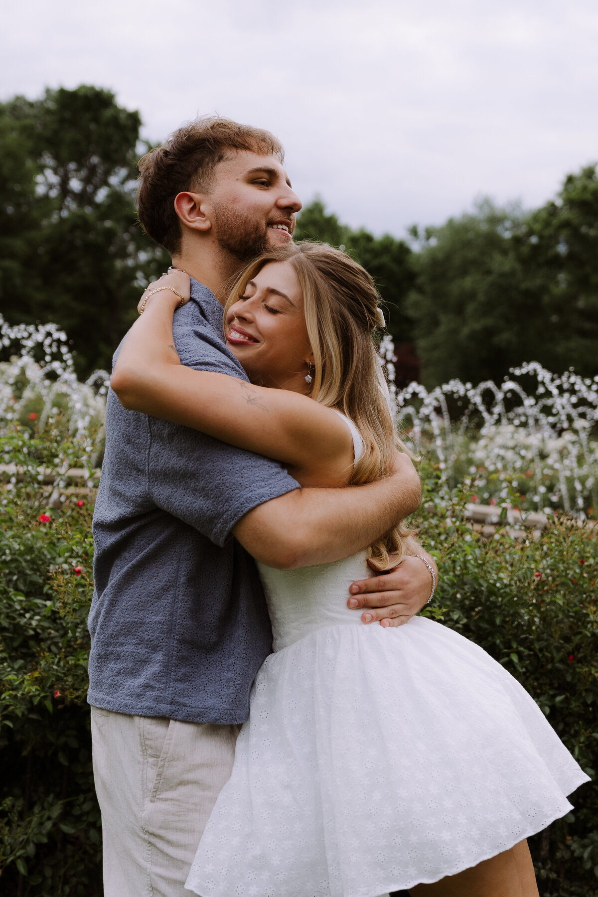 couple hugging in outdoor garden