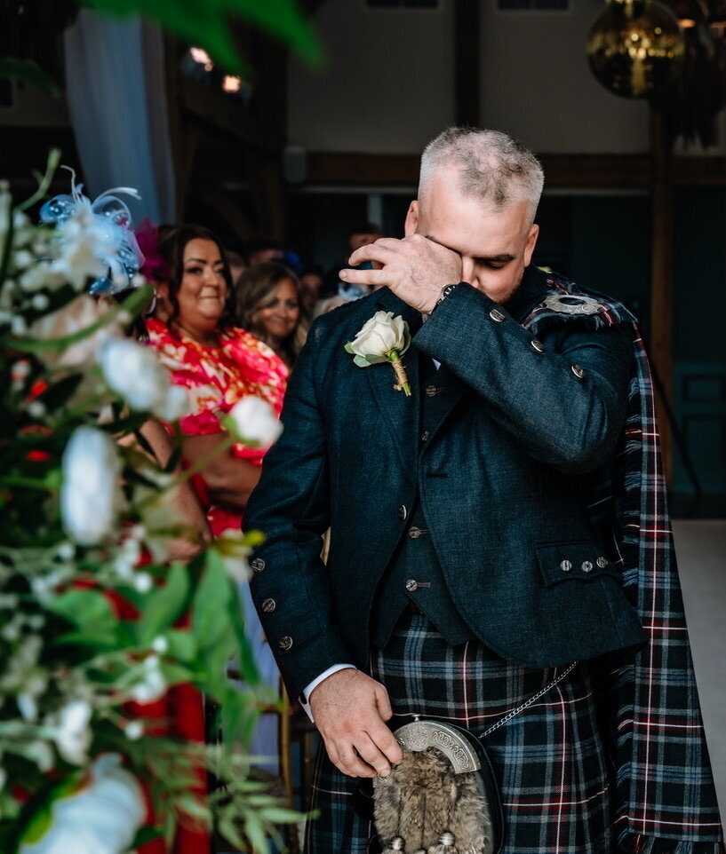 groom crying on wedding day 