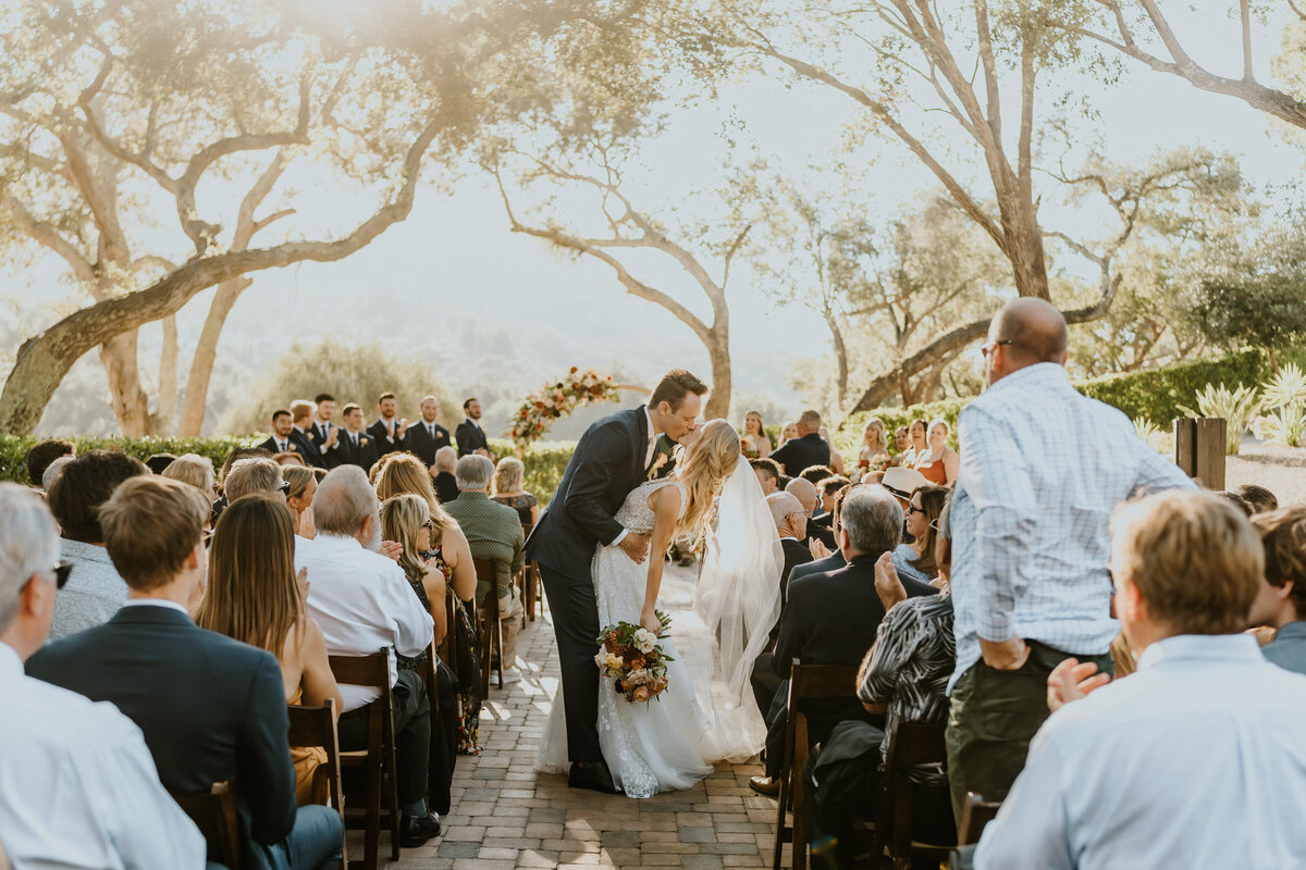Bride and groom kiss after ceremony on wedding day Temecula, California Wedding photographer Yescphotography