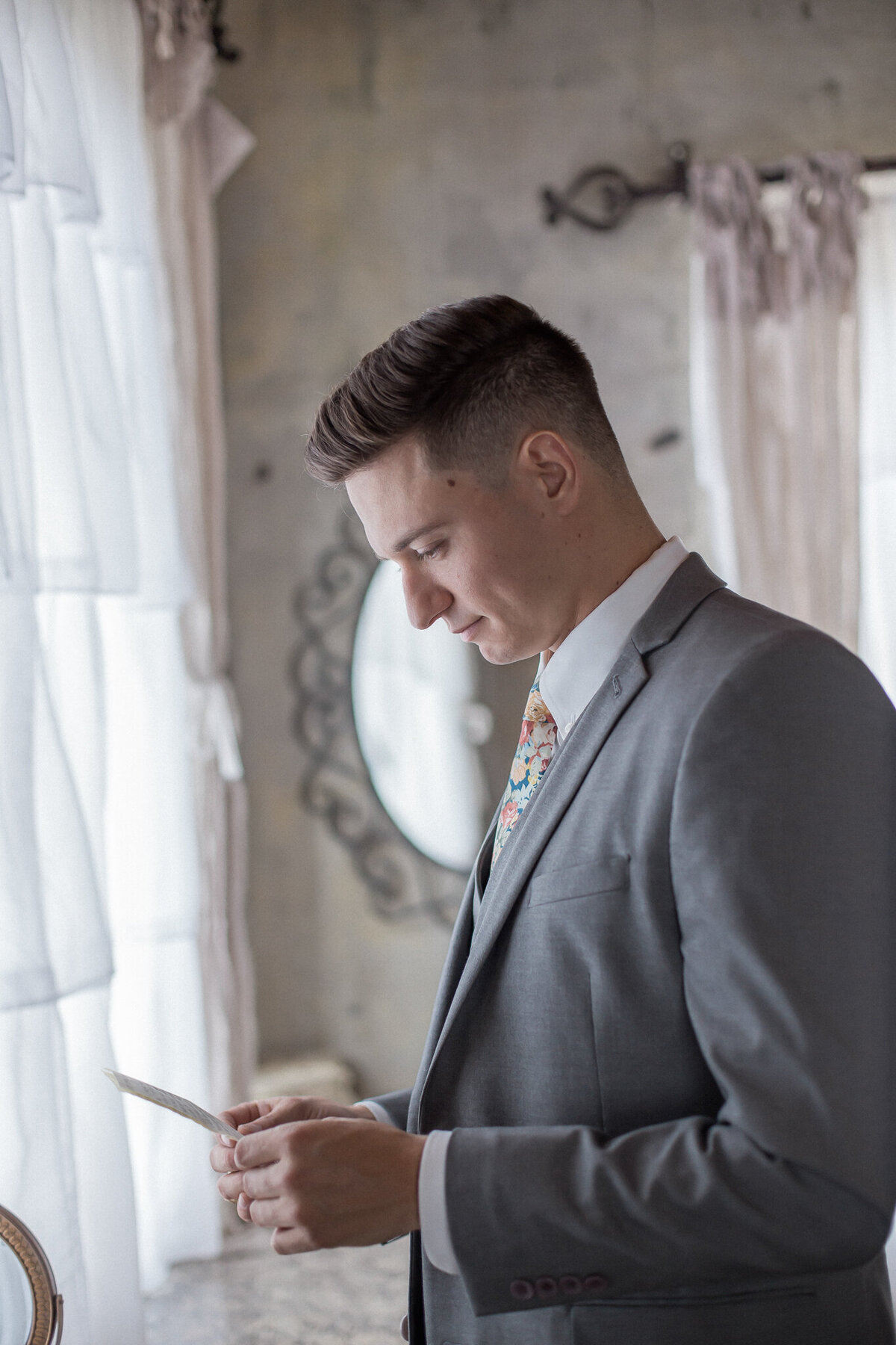 Austin, the groom, reads a letter written by his soon to be wife Lindsey