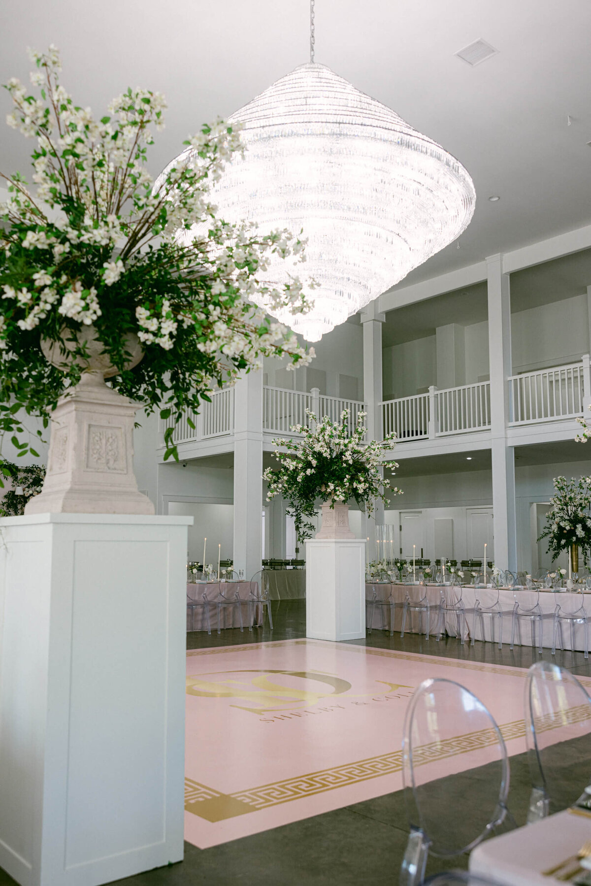 A wedding photo of the reception space showing off  florals and decorations