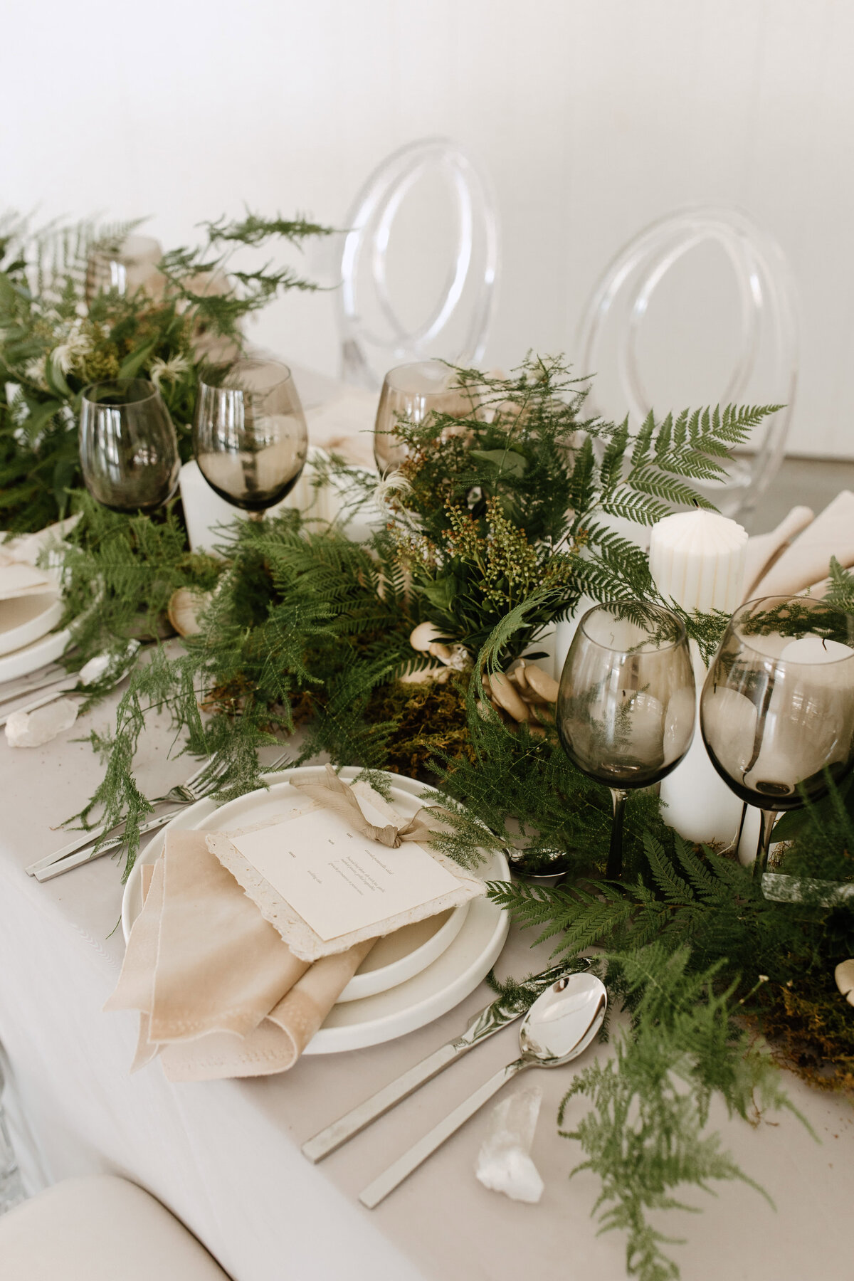 Close up of the garden themed tableware at the reception of a wedding
