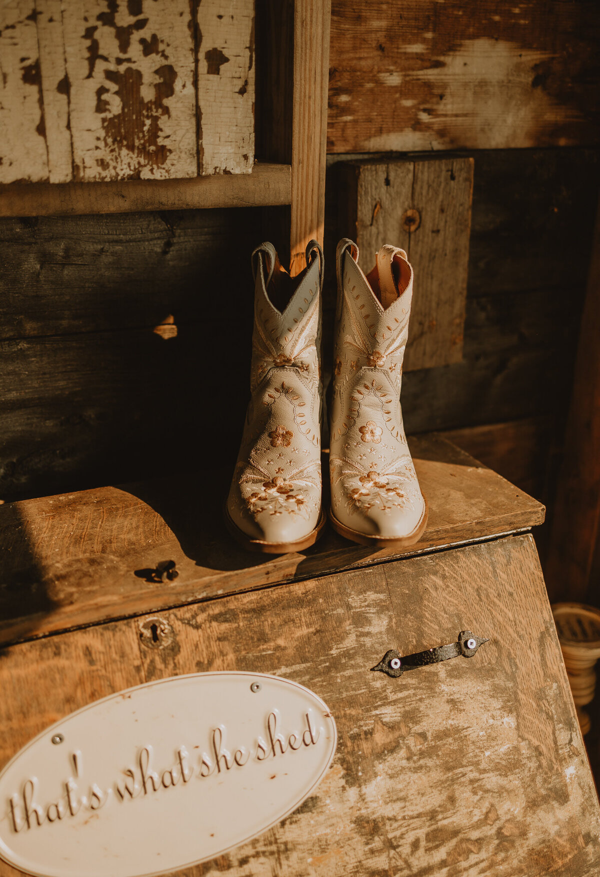 Brides boots on rustic chest