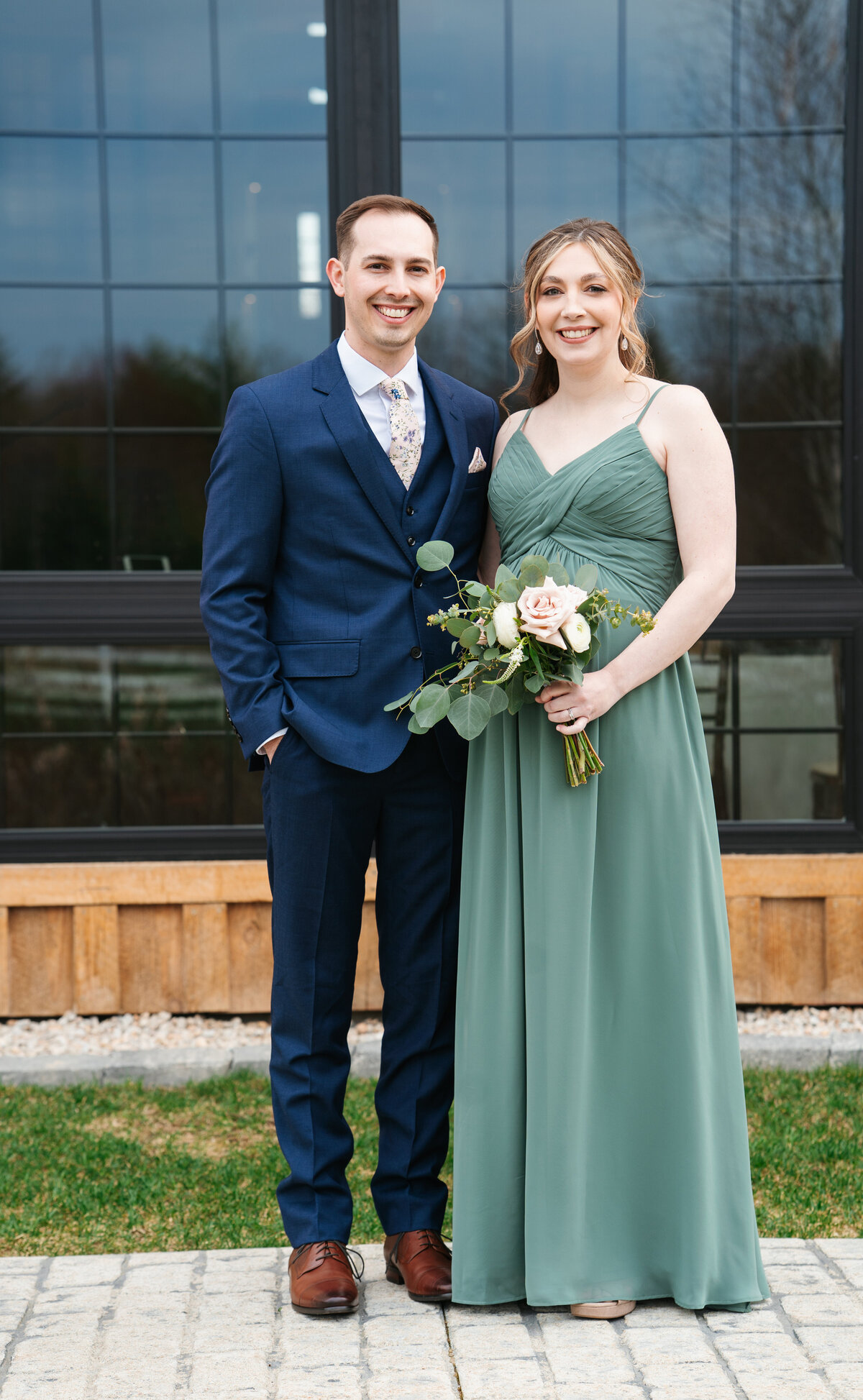 Bride and groom walking hand in hand at their outdoor New England wedding