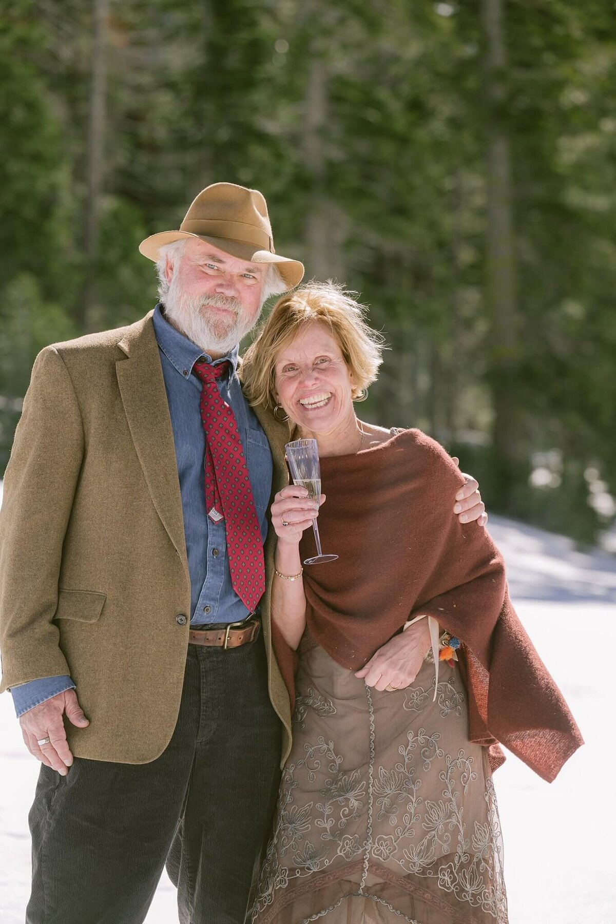 candids during champagne toast elopement at palisades Tahoe