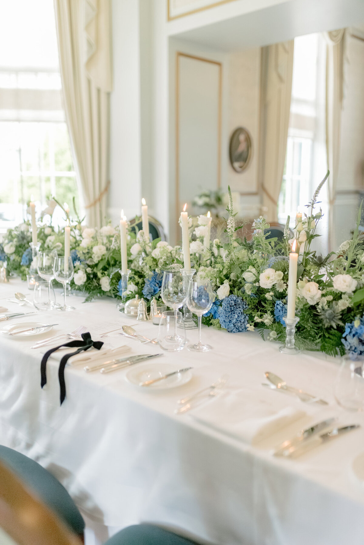 Wedding table with taper candles and flowers by Wild Burnett on a Gleneagles wedding day. Image by award winning luxury wedding photographer Scotland, Jill Cherry Porter.