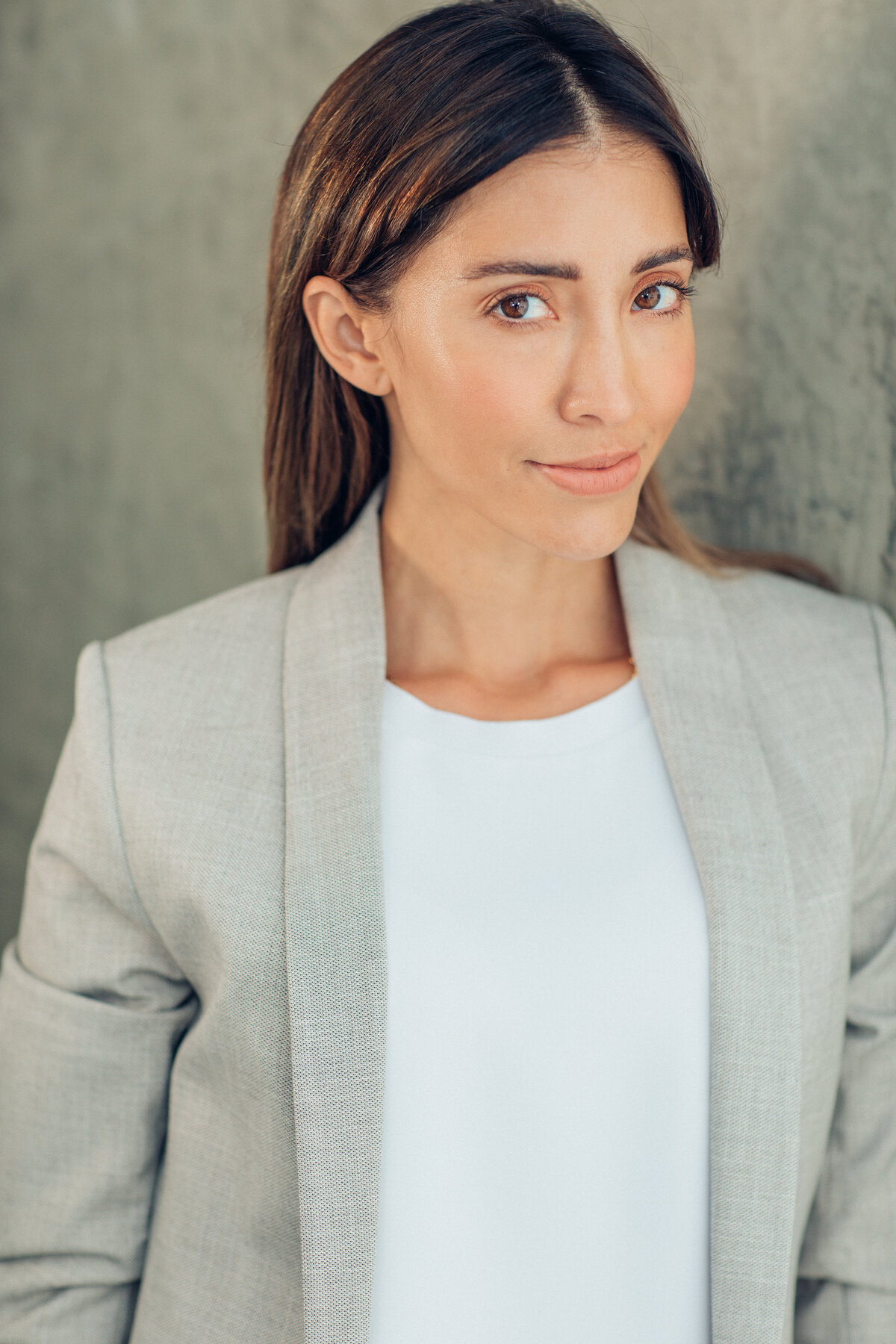 Headshot Photograph Of Young Woman In Outer Light Gray Blazer  And Inner White Shirt Los Angeles