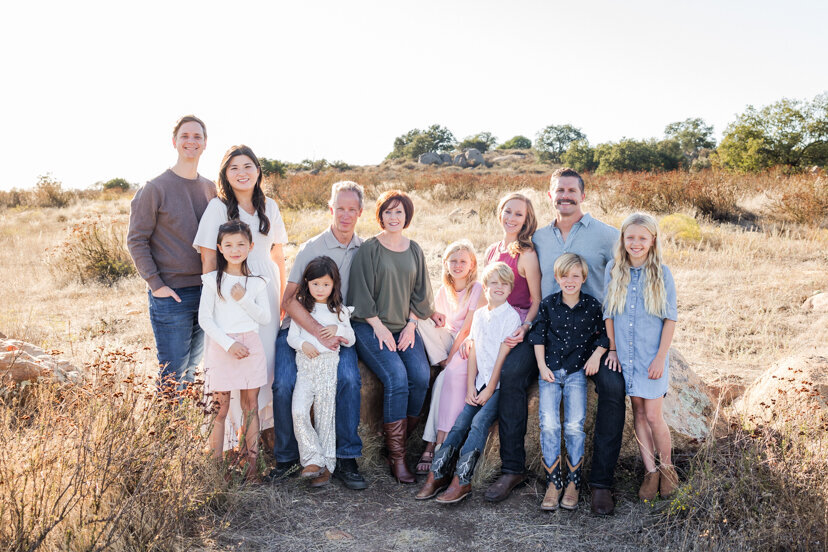 large-family-sitting-on-rock-wrights-field-san-diego
