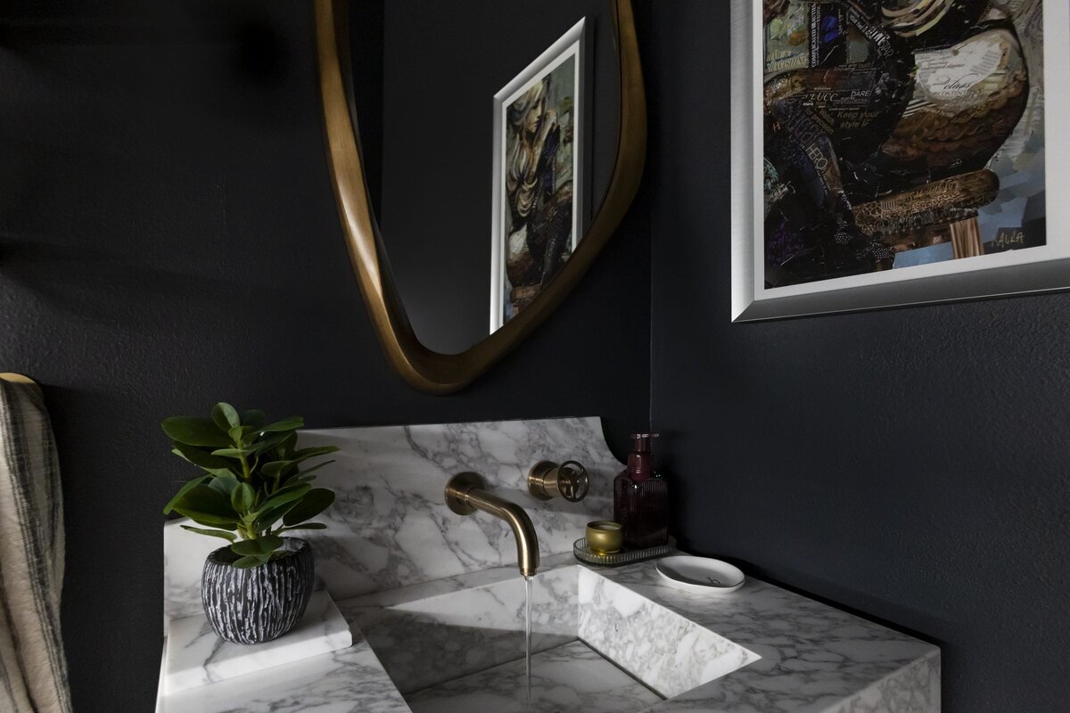 dewine design orlando interior designer contemporary coastal moody bathroom gold faucet and marble counter