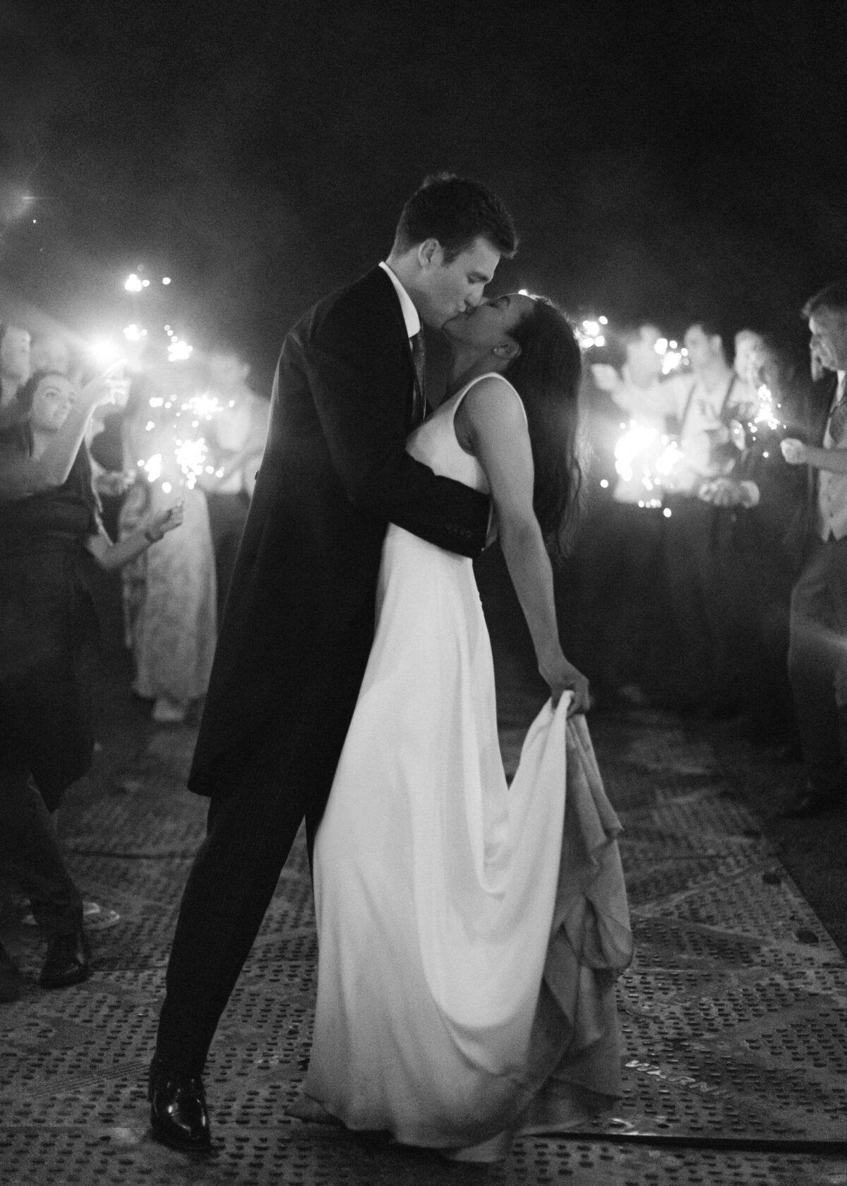 chloe-winstanley-weddings-sparklers-bride-groom-kiss