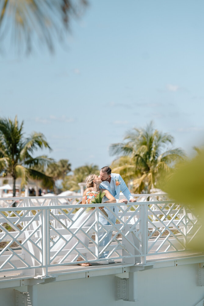 a bride and groom at their Bahamas wedding on a path