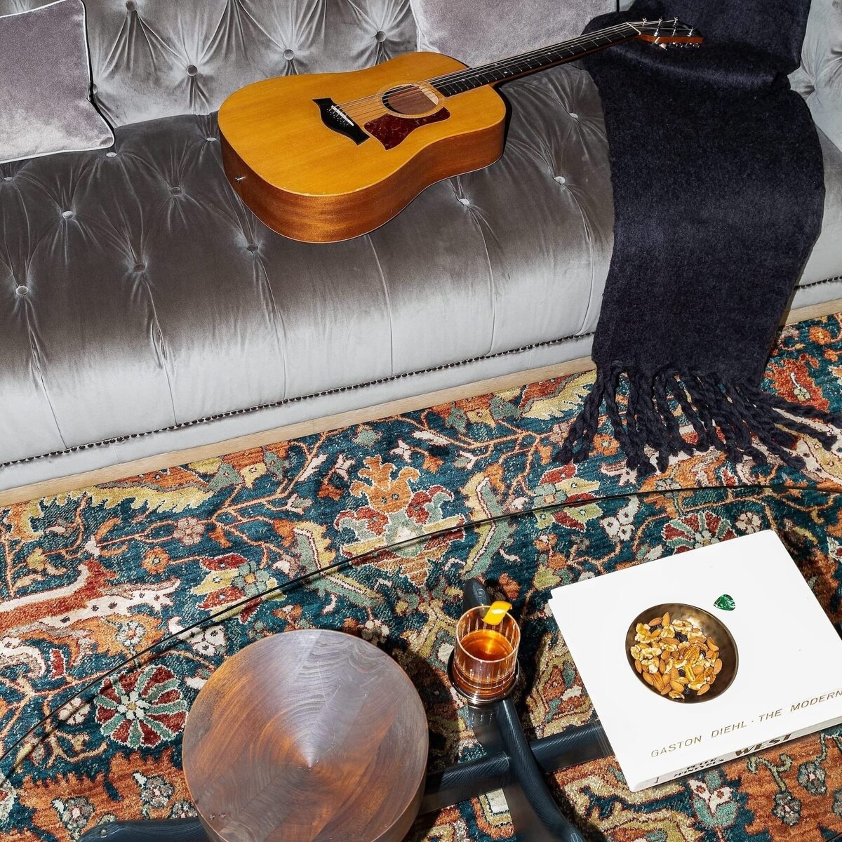 rebekah nicole interiors arbor garage with rug and guirar and blanket on gray sofa