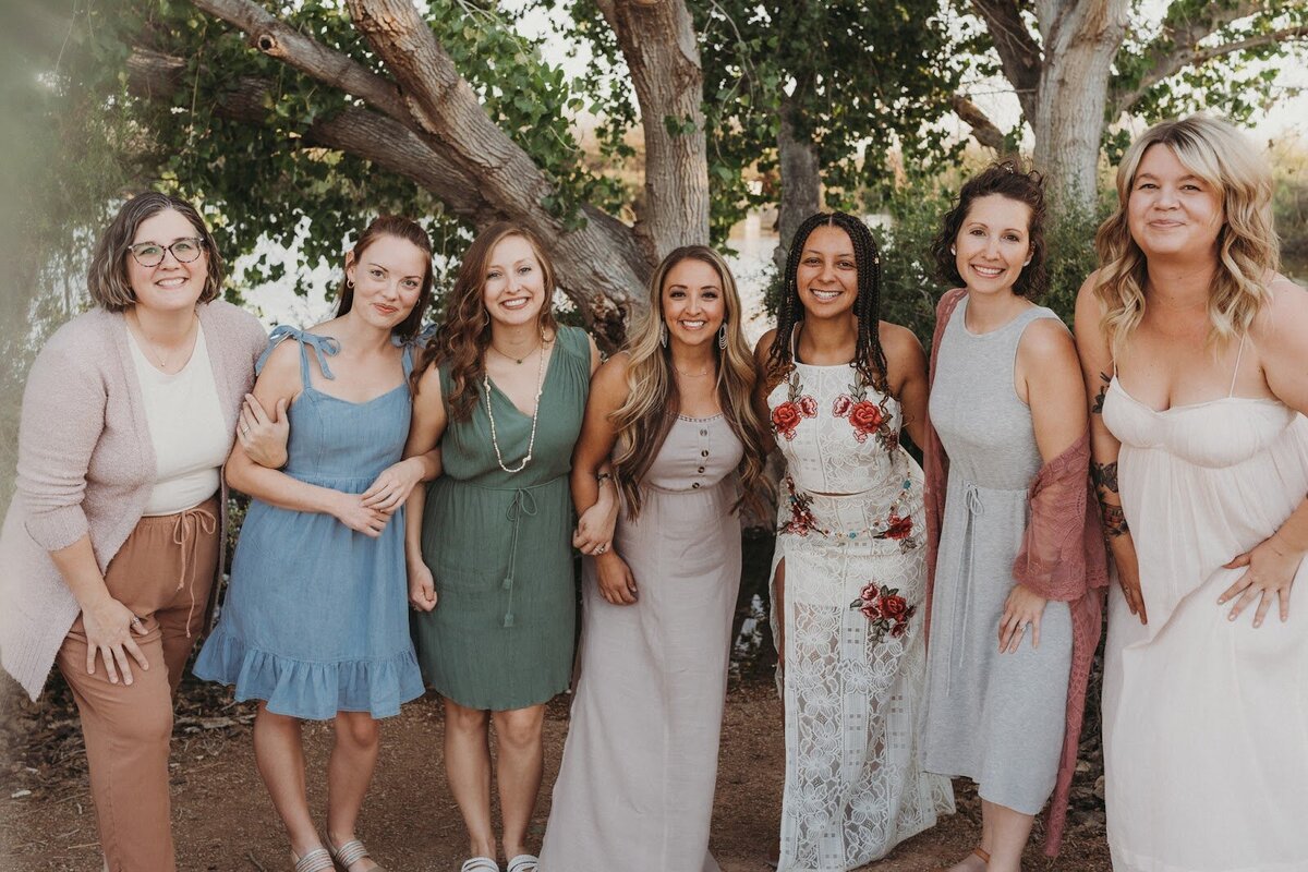 Cherry Blossom Doula team smiling at the camera and embracing each other