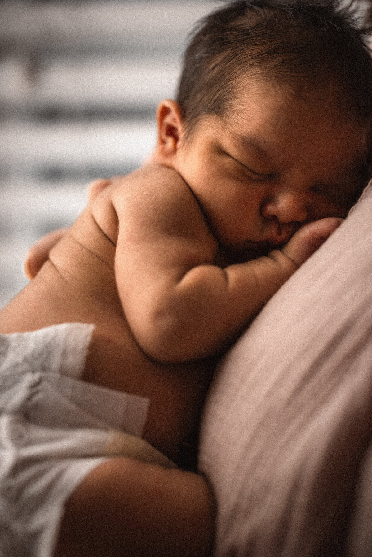 mother holding newborn baby