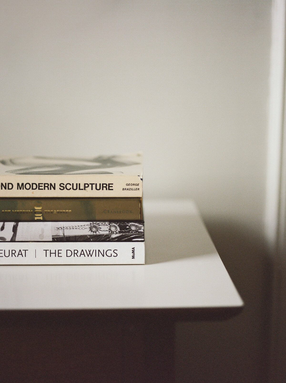 film branding photo of art books, clean desk, web design, interior brand photography at ALEO Detroit