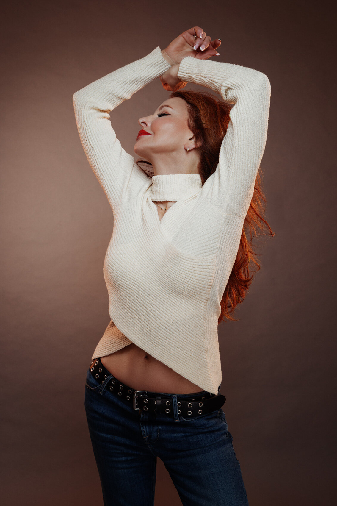 Graceful portrait of Andrea Tomasetti in a white top, captured with a serene expression by Ylva Erevall.