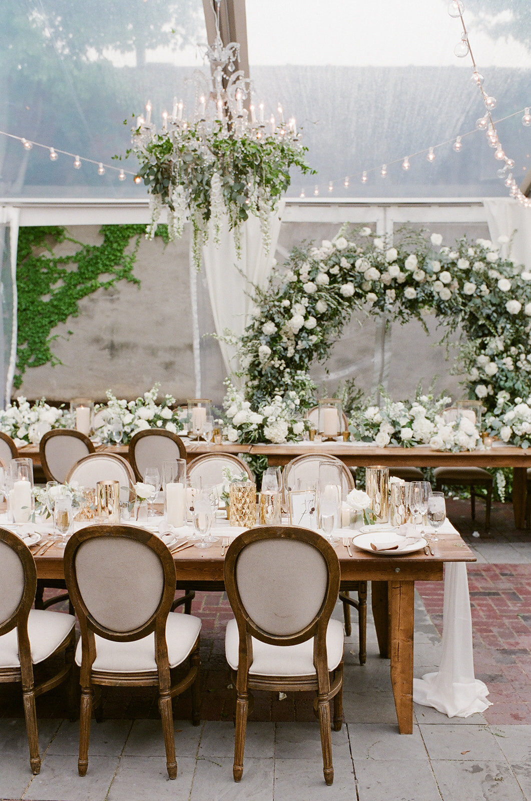 Chicago Illuminating Co. Tent Wedding with Lush Floral Arch_37