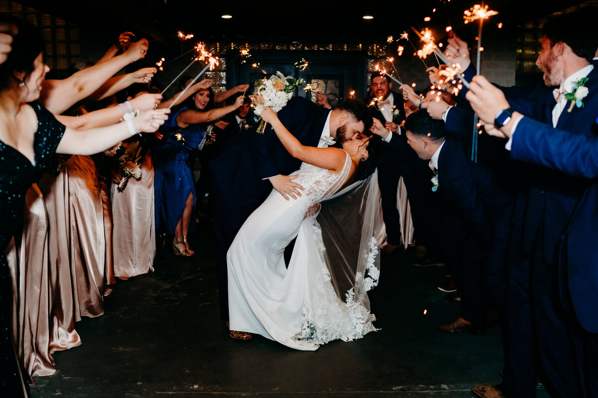 sparkler exit of bride and groom kissing after wedding in Delcambre, la