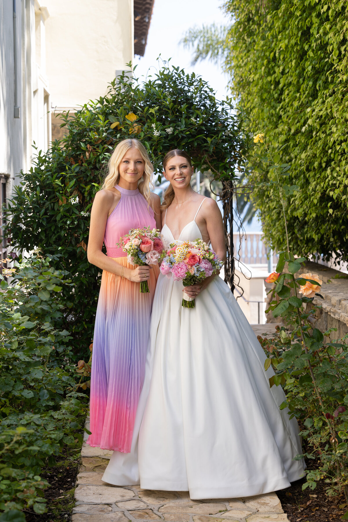 bride and bridesmaids holding a bridal bouquet