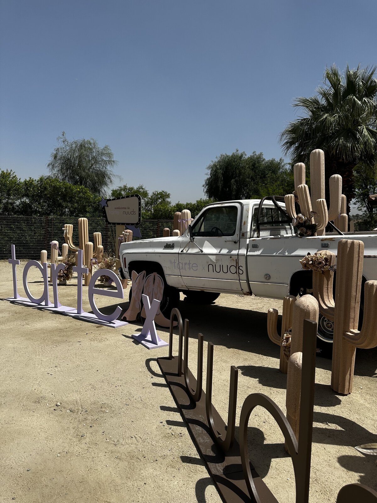 Tarte beauty activation by The Works Collective | custom poolside event installation in Palm Springs, California.
