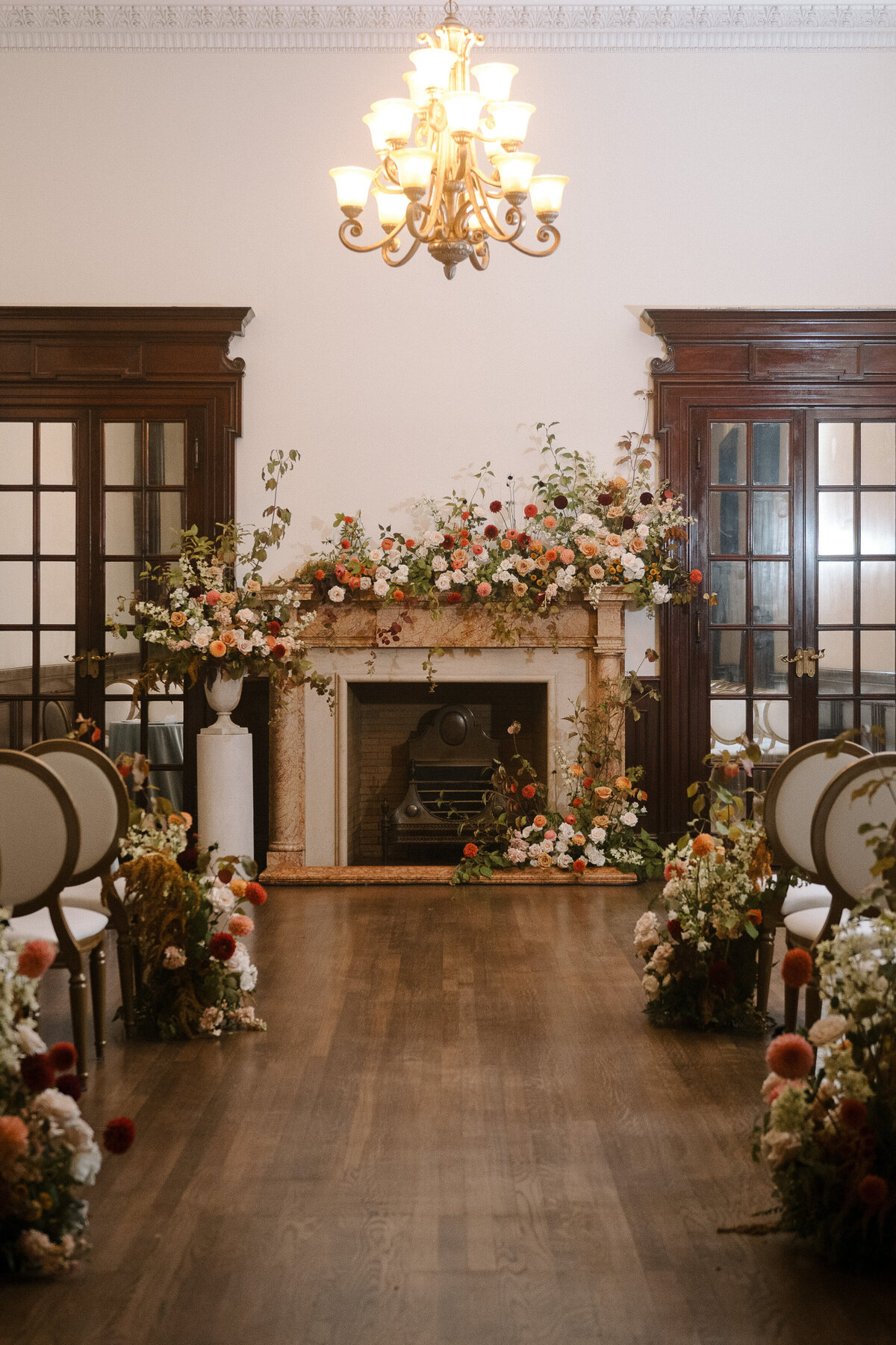 A lush meadow of flower arrangements at a Theatre St James wedding ceremony. 