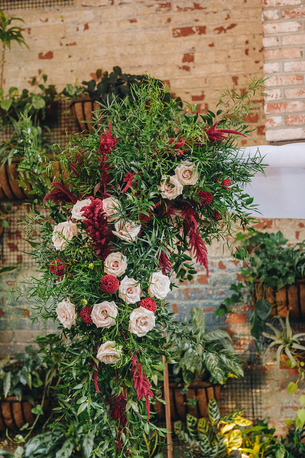 wedding flower arch ceremony details at brooklyn winery , flowers by Lucy's Flowers NYC