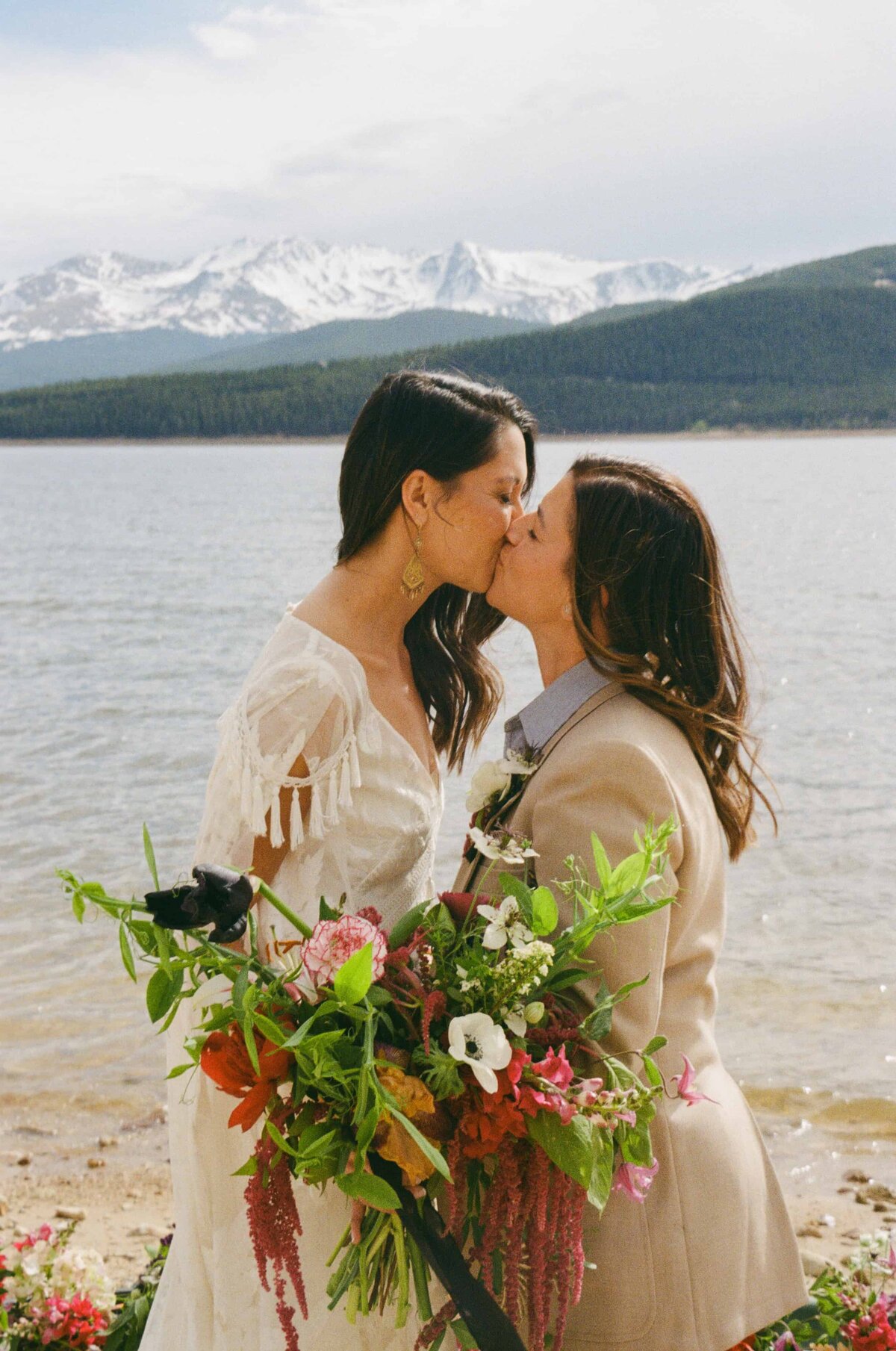 Two brides kiss during their Colorado Elopement in Leadville.