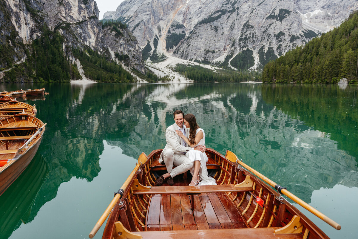 Couple sitting stylish boat wedding portrait