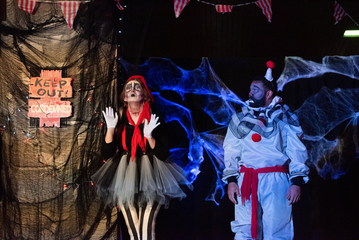 A group of people performing in costumes