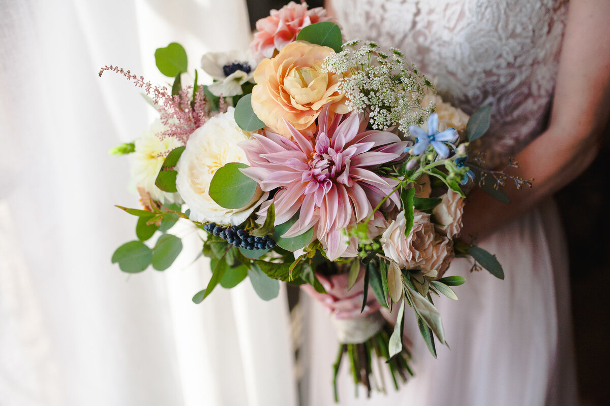 Bridal bouquet detail photograph of a summery flower arrangement.