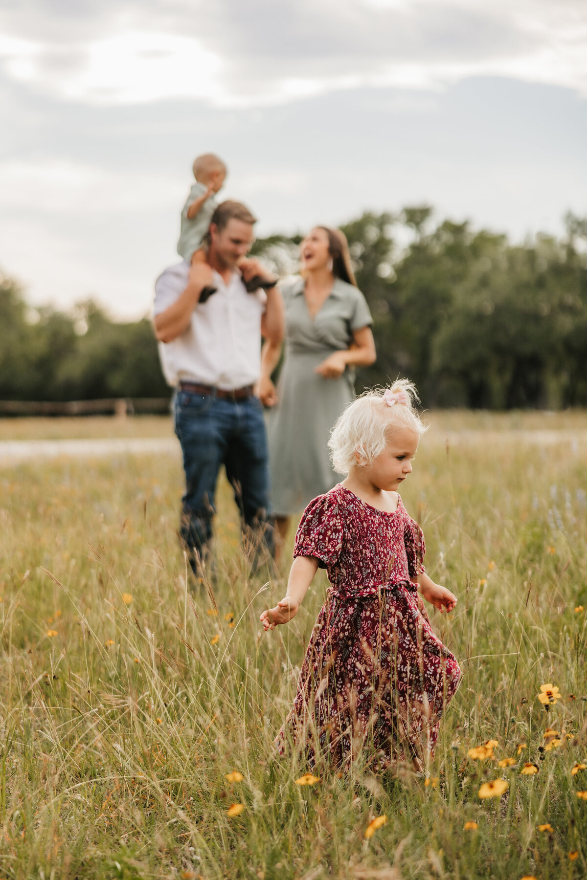 toddler-with-family-in-background
