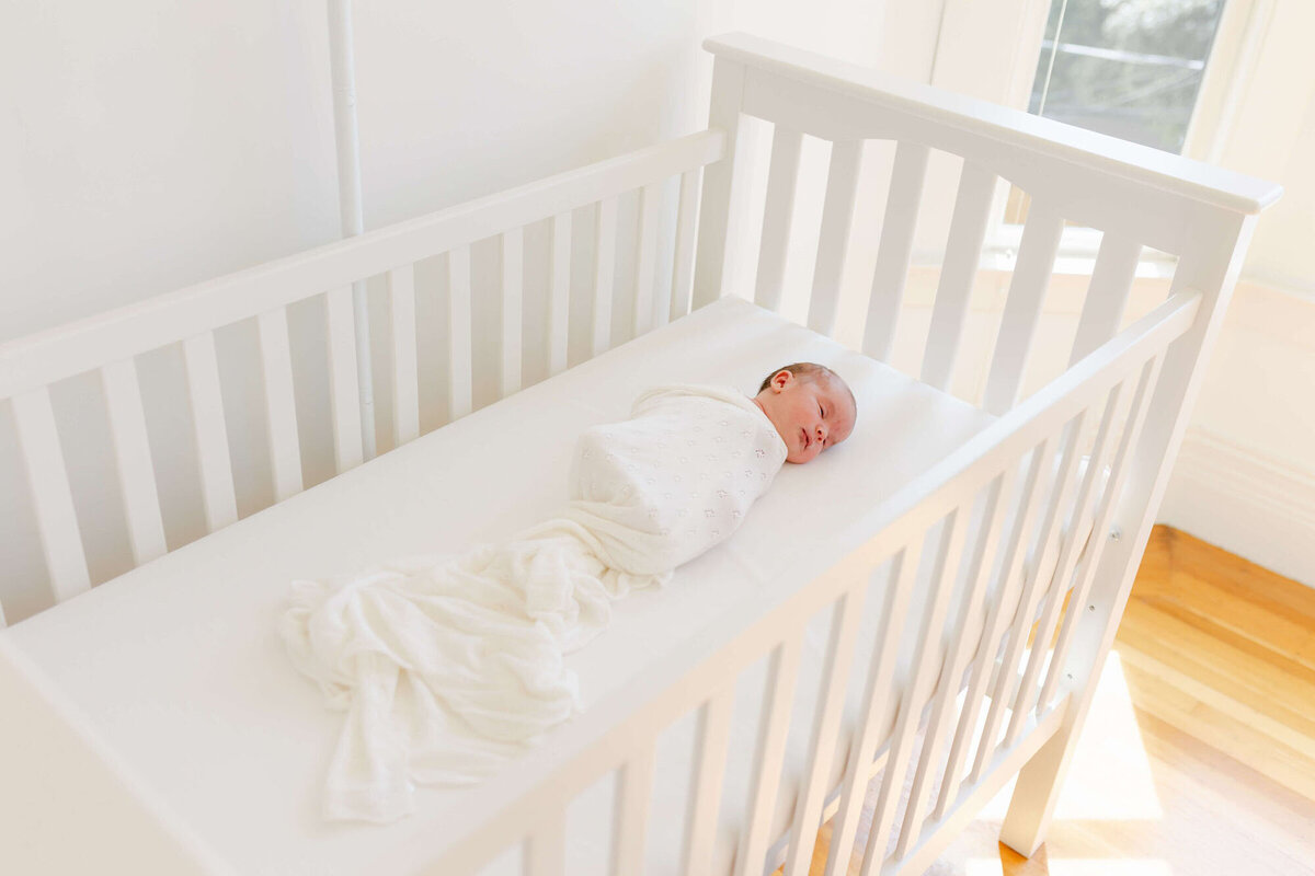 Lifestyle Bay Area newborn family photography in nursery with parents and baby.