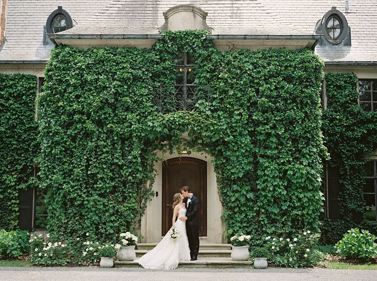 Bride and Groom in Front of Greencrest Manor