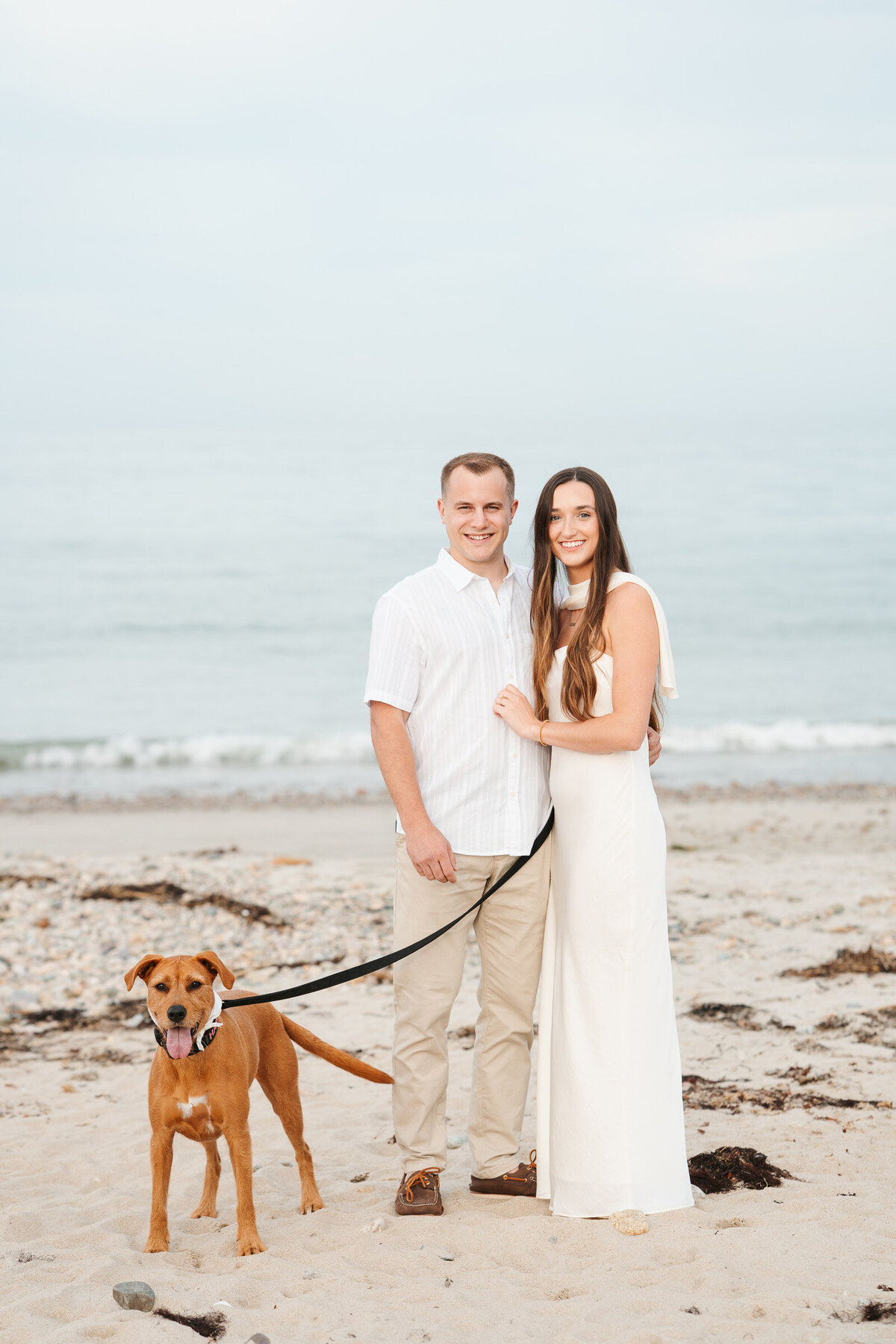 Candid ocean engagement portraits in New England with relaxed emotional storytelling