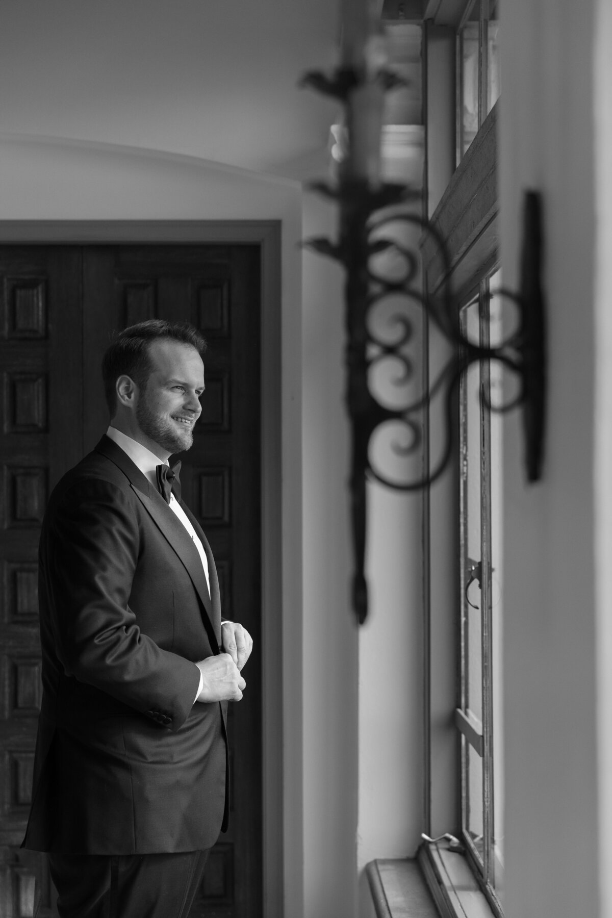 Groom looking at the window