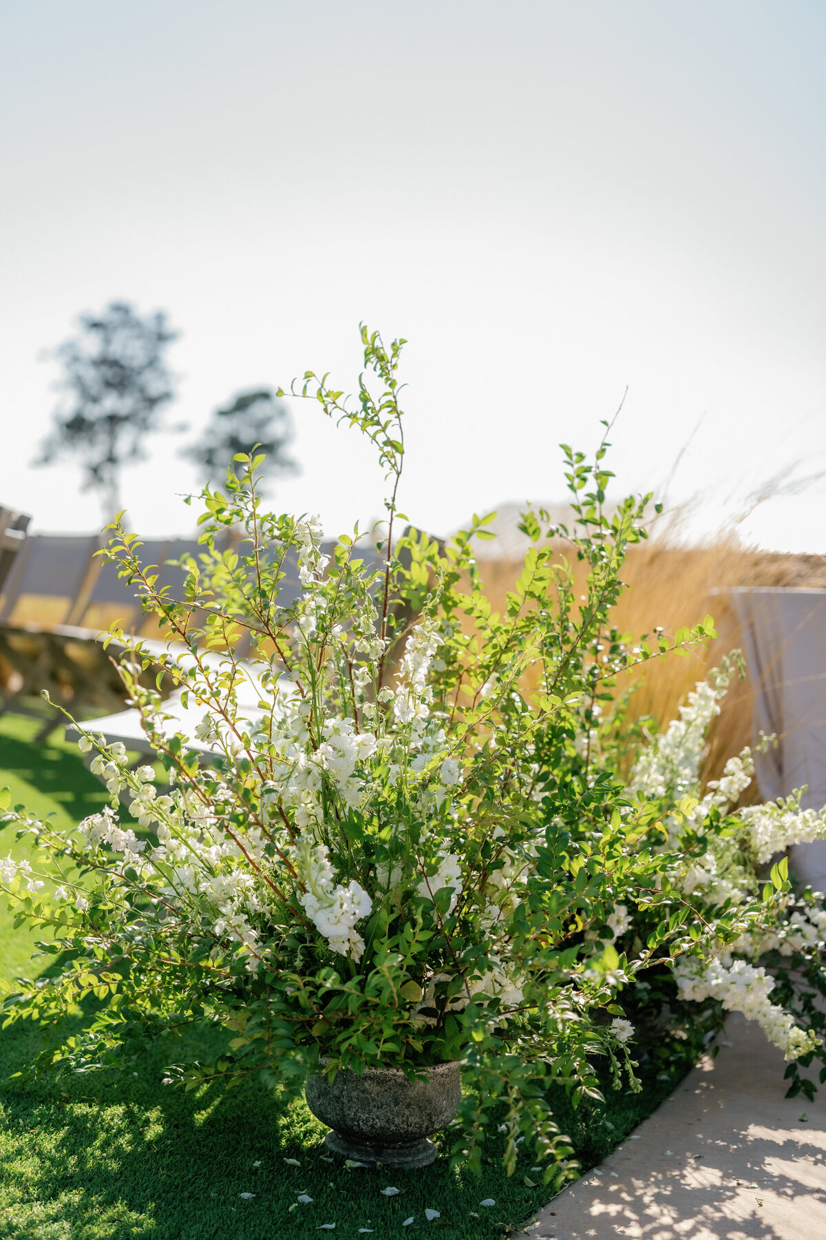 fresh white and green minimal wedding ceremony arrangement by max gill design at infinity hill ceremony