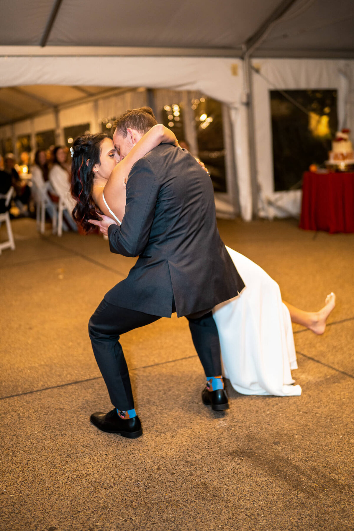 Bride and groom share a dip kiss during their first dance at a wedding venue in pittsburgh PA. Captured by Pittsburgh Wedding Photographer Michael Fricke