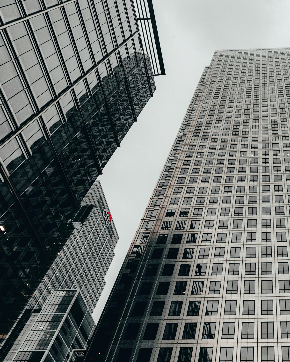 Angled, zoomed in photo of three large buildings