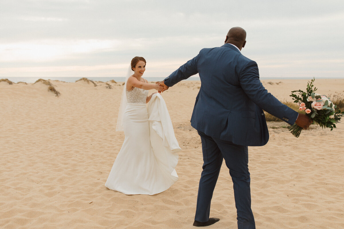Bride and groom dancing in the sand for their Cabo San Lucas wedding