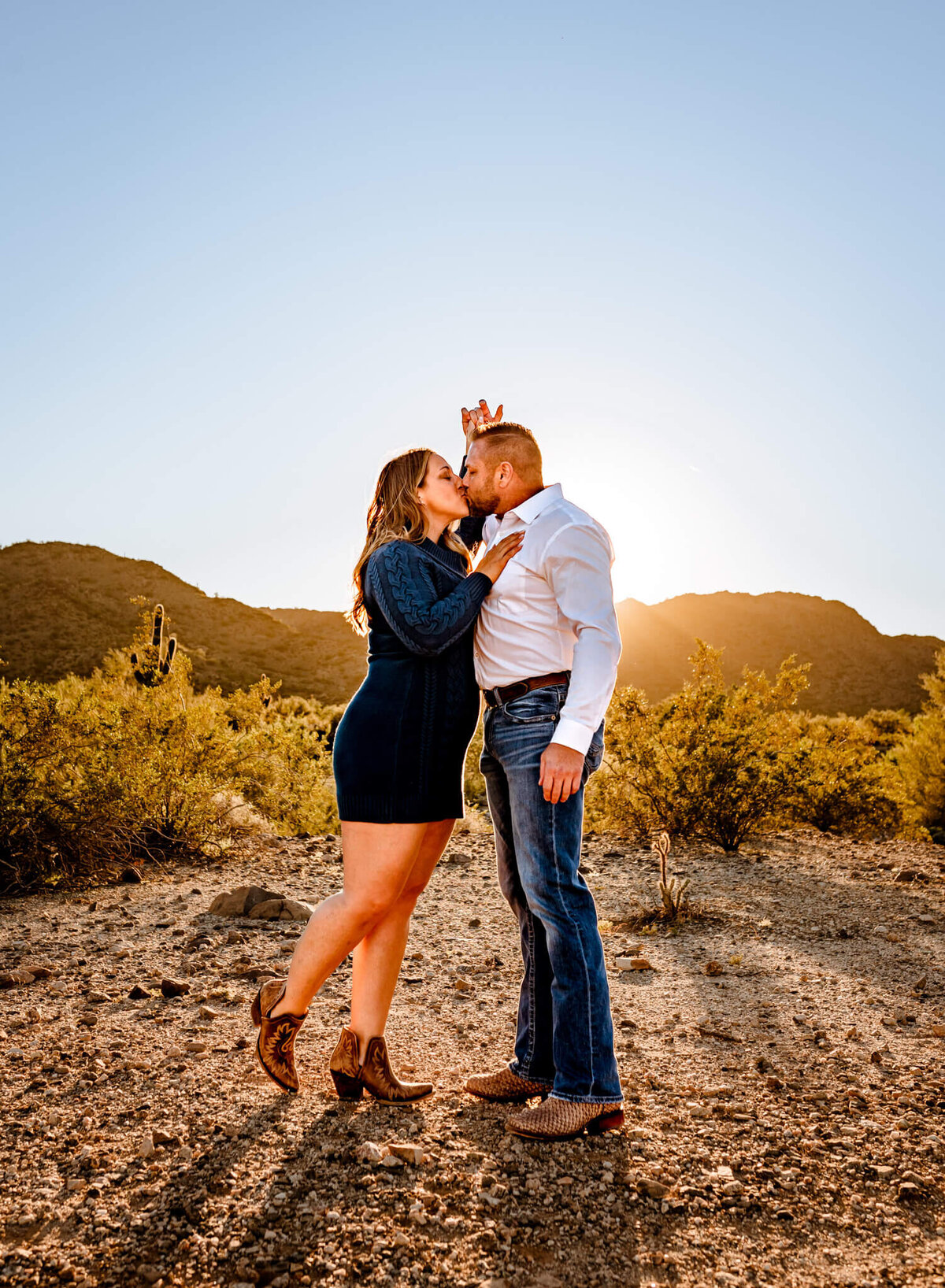 couple kissing during family photography session in Arizona