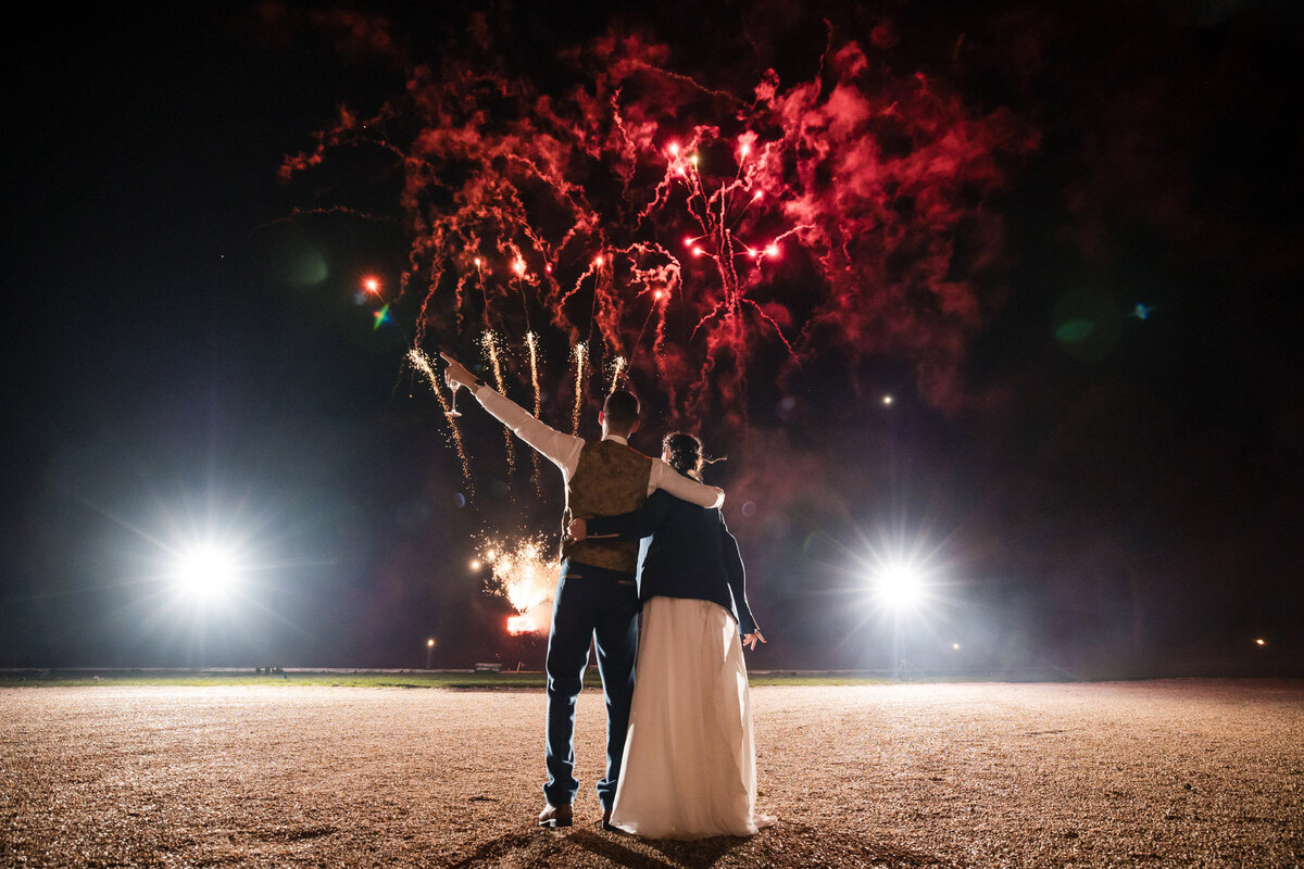 Bride and Groom watch fireworks at Rockbeare Manor