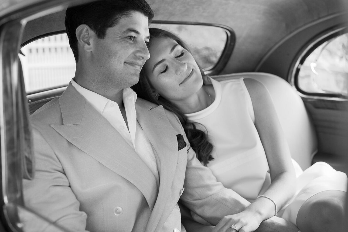 wedding couple pose in front of vintage car for hildene vermont wedding