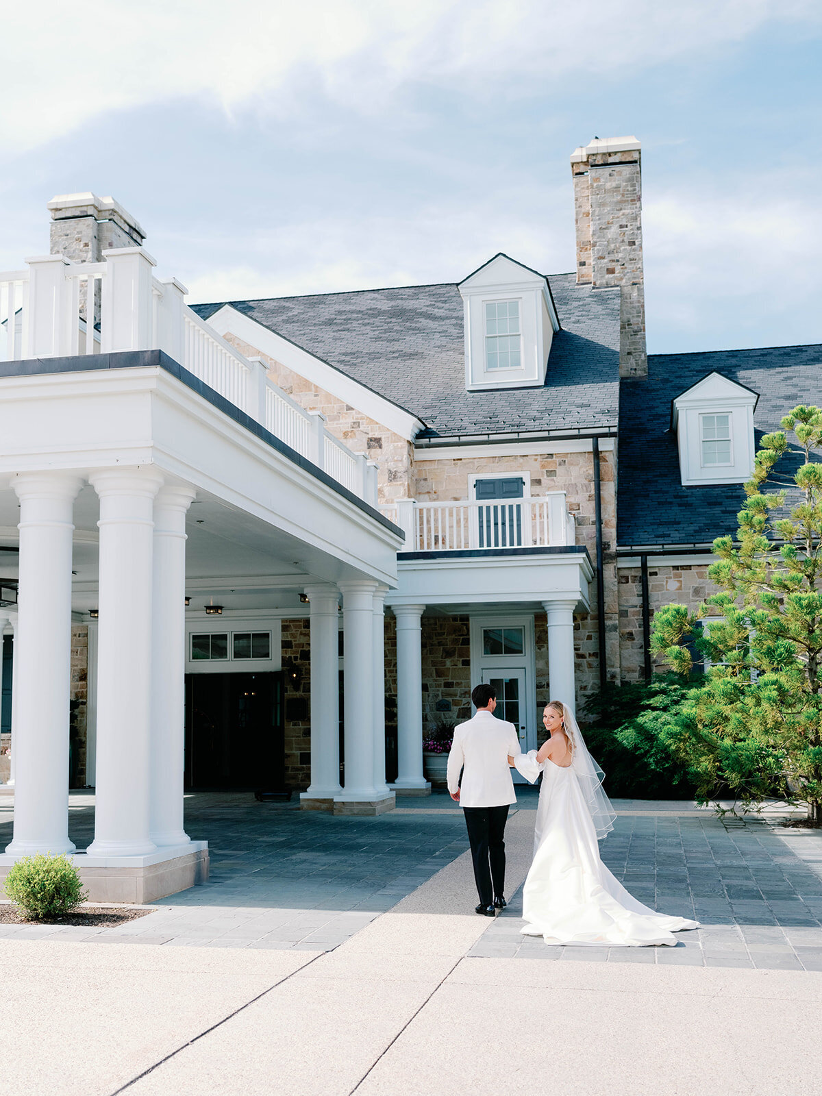 Couple walking  in wedding attire