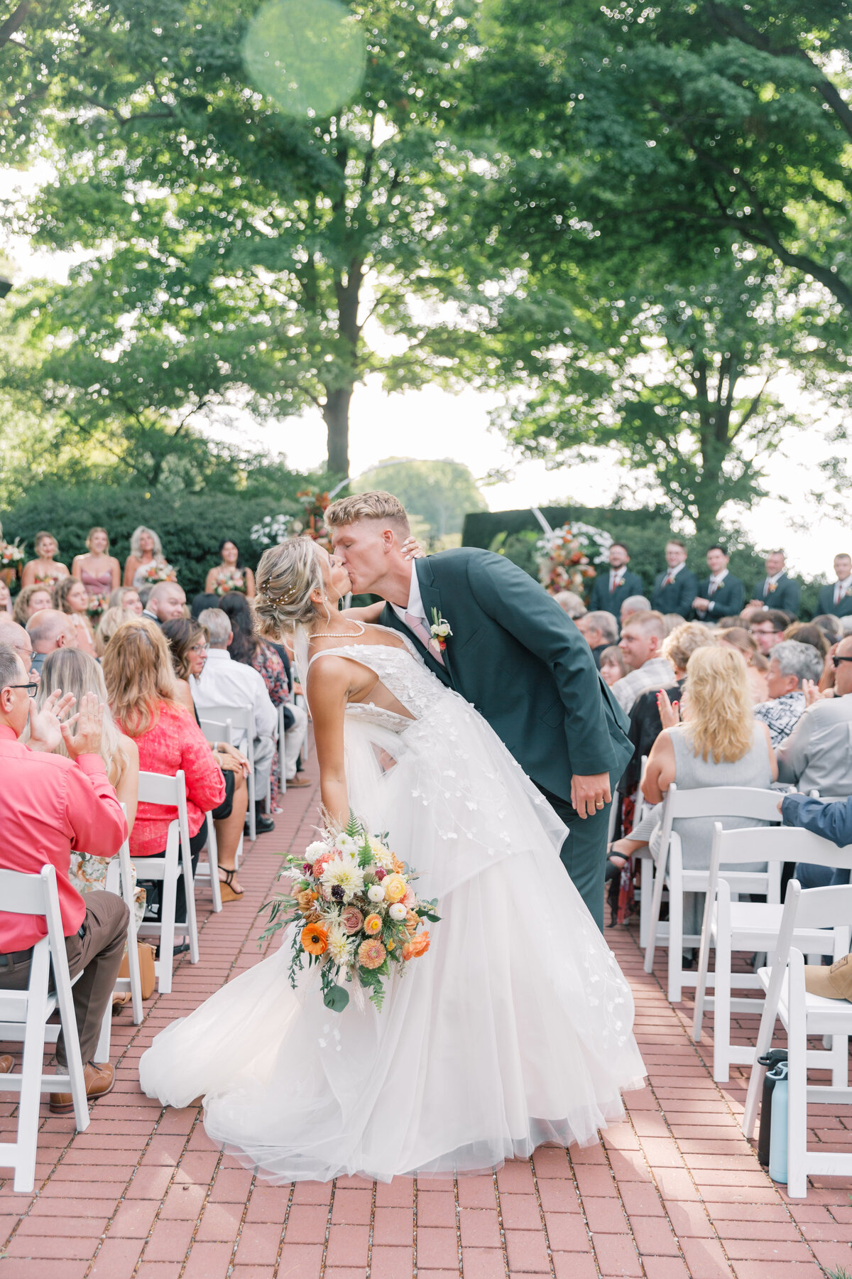 Drumore Estate couple kissing walking down the aisle after their ceremony