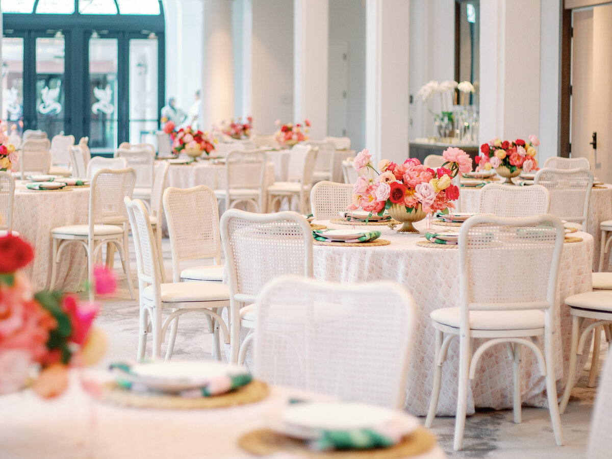 A beautifully styled wedding reception setup featuring elegant tablecloths, refined china, and simple yet sophisticated centerpieces. This timeless design strikes the perfect balance between understated elegance and effortless luxury, creating an inviting atmosphere for a memorable celebration.
