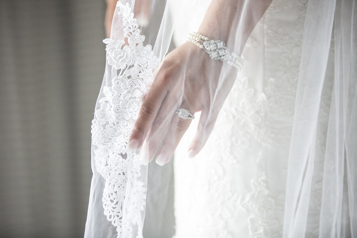 bride holding veil before wedding