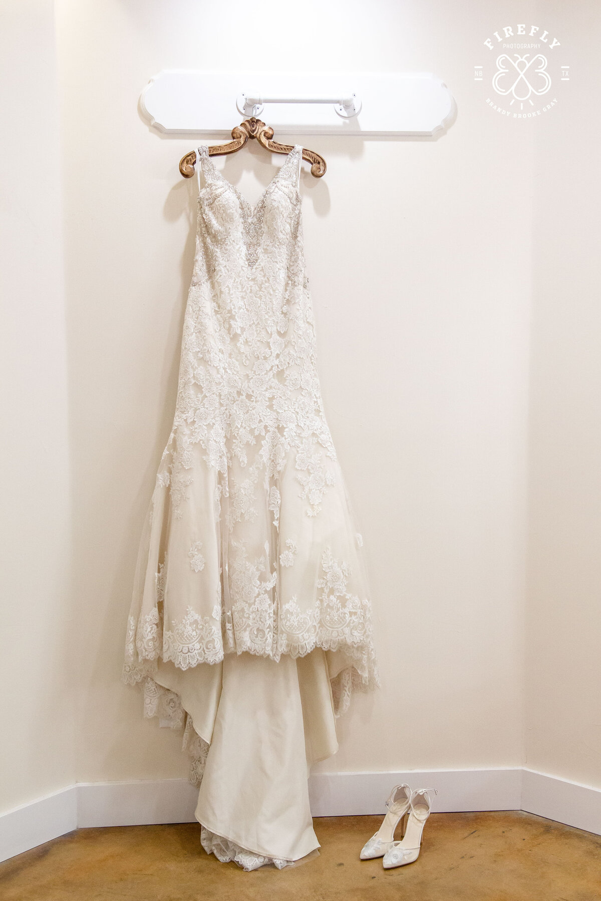 wedding dress detail hanging on vintage hanger Sendera Springs in Kerrville Texas